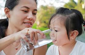 mother and child drinking water